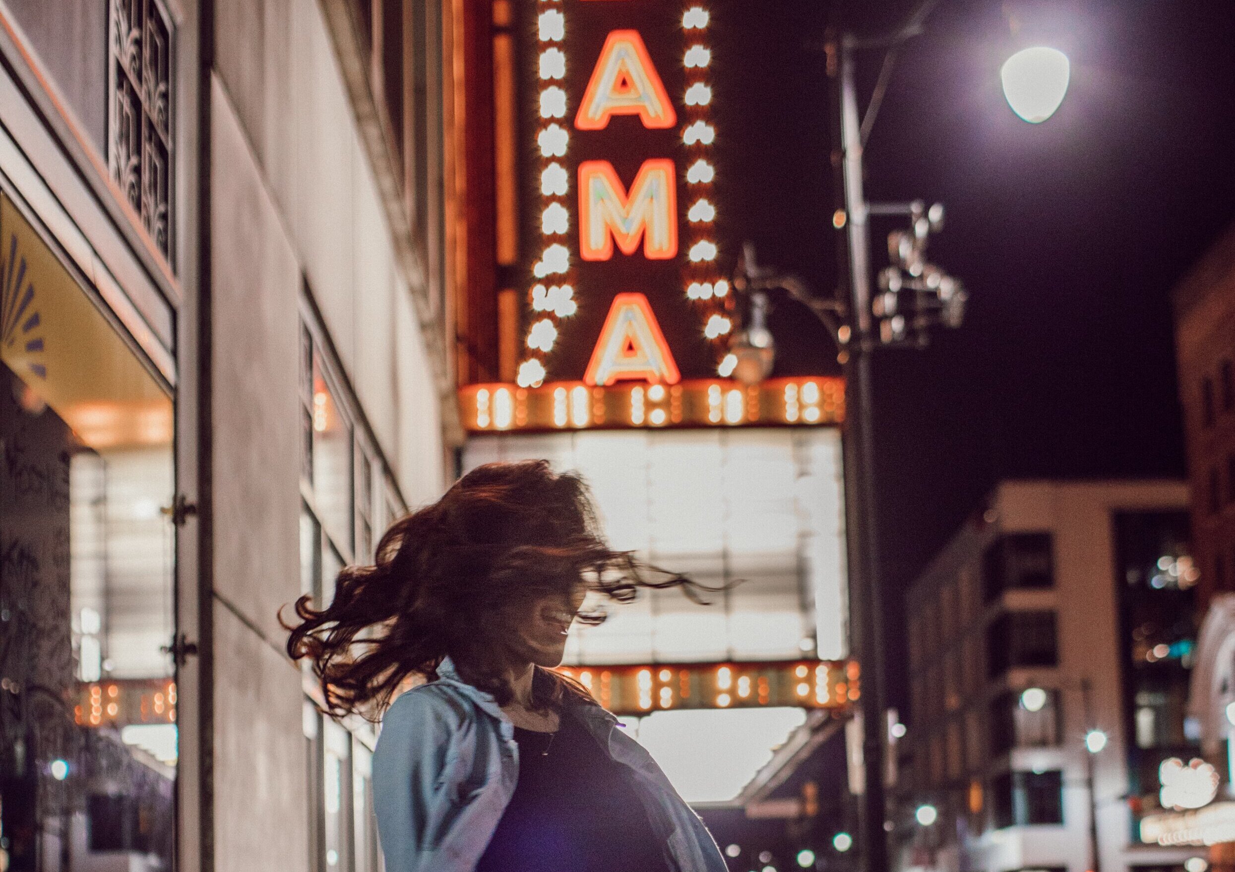 girl shaking her hair in downtown Alabama